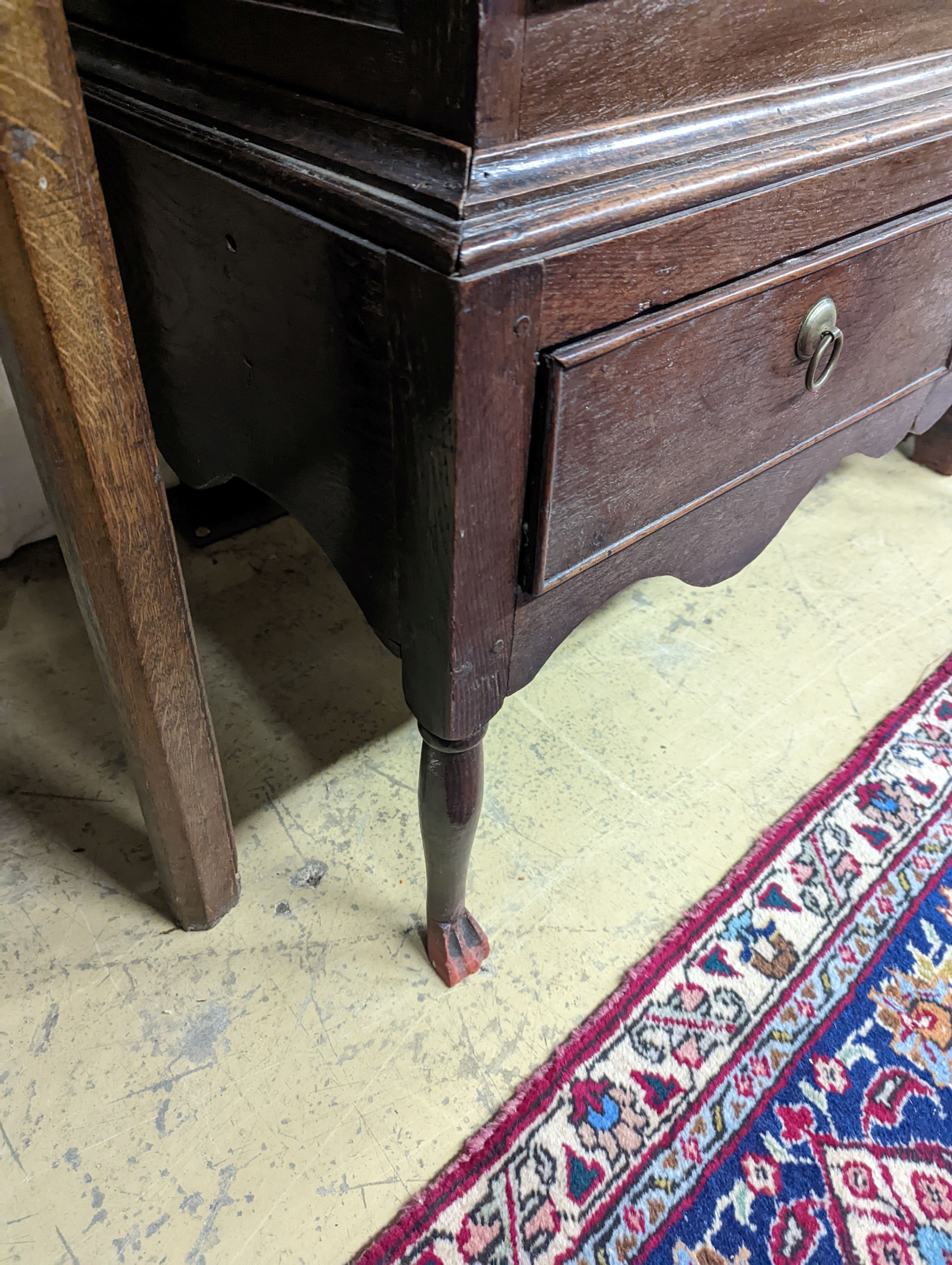 A mid 18th century oak chest on stand, width 89cm, depth 52cm, height 126cm